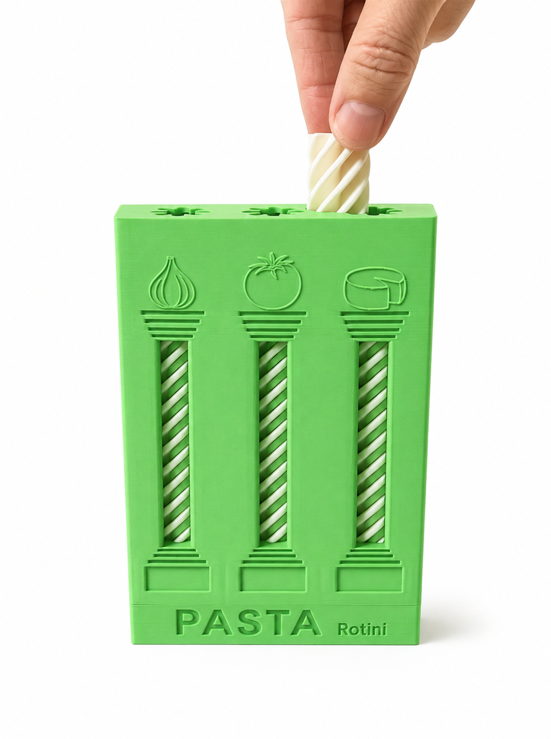 Loading a toy pasta piece into the green dispenser
