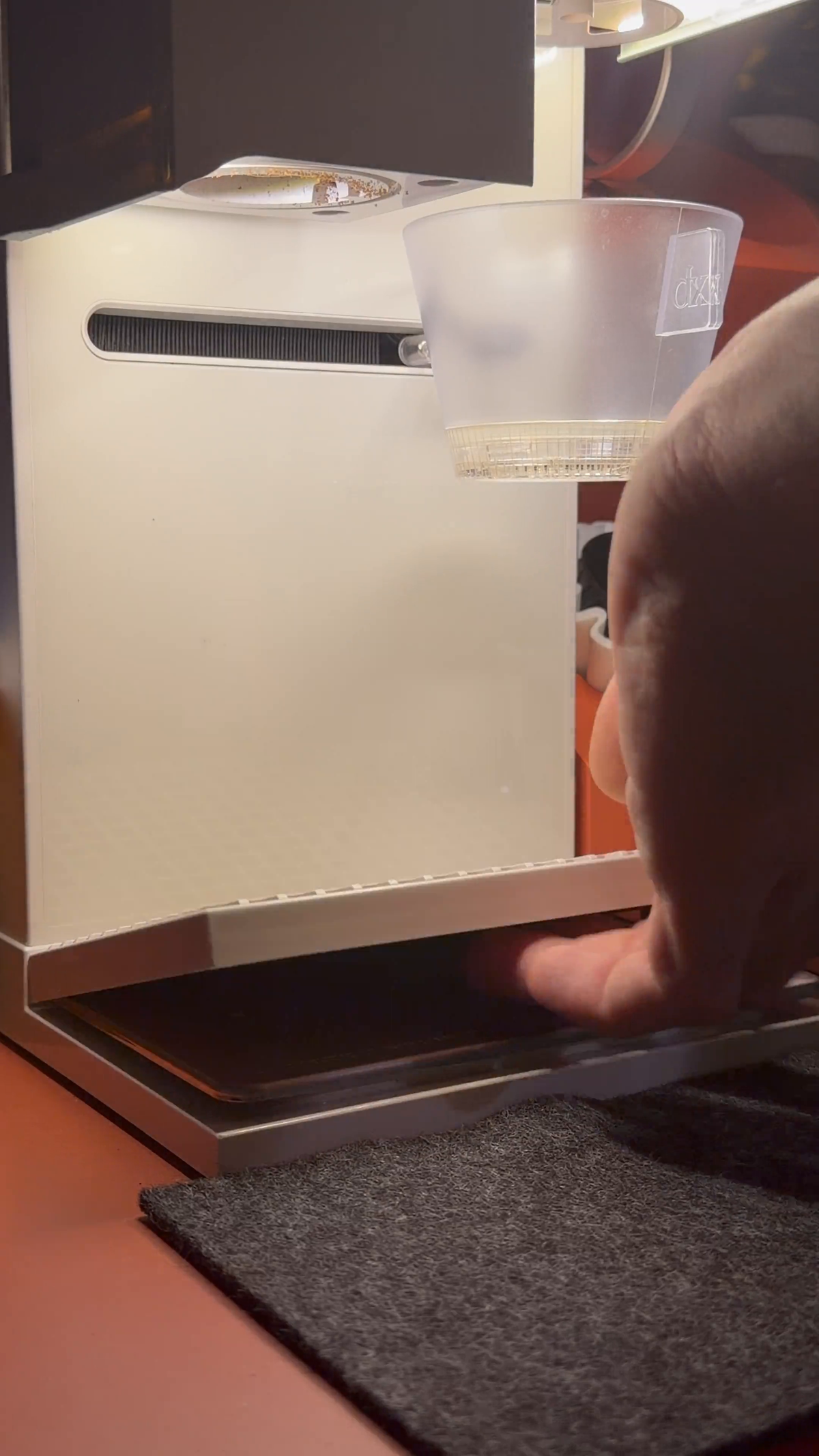 Studio drip tray sliding beneath an xBloom Studio coffee machine